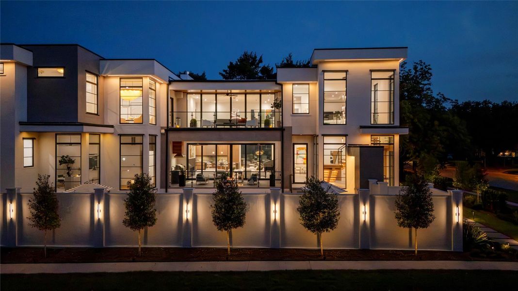 [Privacy Wall] Surrounded by lush landscaping, the grounds are designed for elevated entertaining.