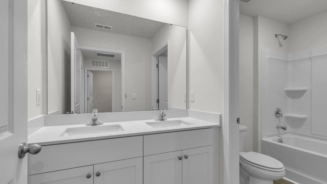 Representative furnished interior of a home built from the TAYLOR by D.R. Horton in Belle Grove, Wendell (Image 10).