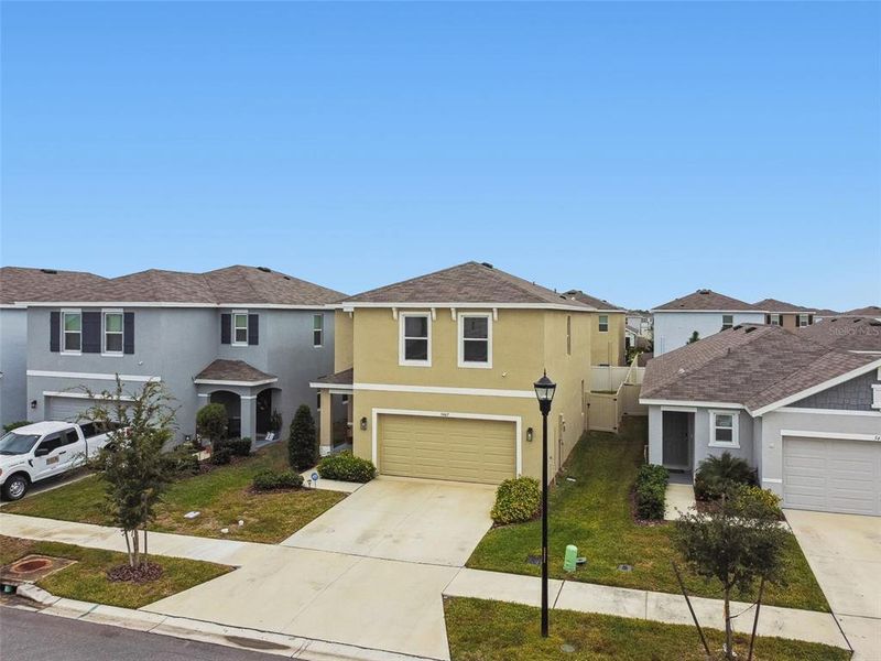 Front exterior of a new home in Westgate at Avalon Park, Wesley Chapel, FL, highlighting curb appeal (Image 31).