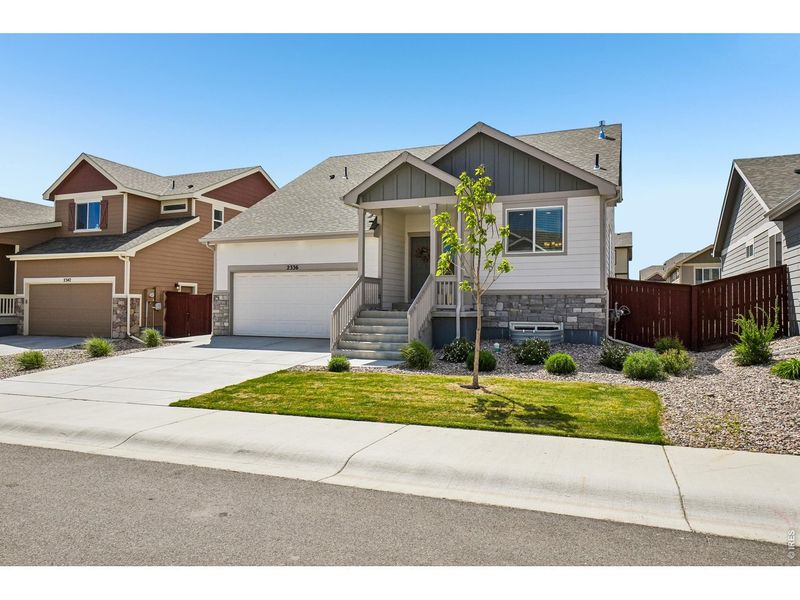 Front exterior of a new home in , Windsor, CO, highlighting curb appeal (Image 21).