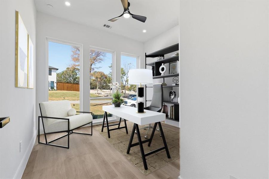 Home office featuring light wood-style floors, ceiling fan, and recessed lighting Home office featuring light wood-style floors, ceiling fan, and recessed lighting