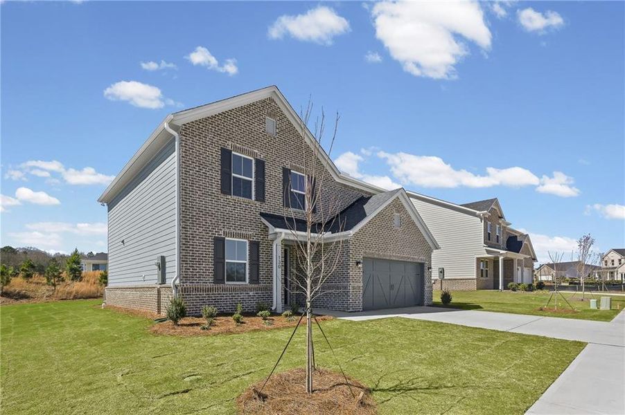 Front exterior of a new home in Overland, Locust Grove, GA, highlighting curb appeal (Image 18).