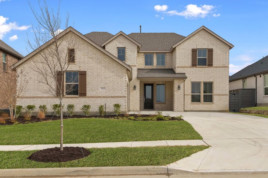 Front exterior of a new home in Union Park, Little Elm, TX, highlighting curb appeal (Image 2). Front exterior of a new home in Union Park, Little Elm, TX, highlighting curb appeal (Image 2).