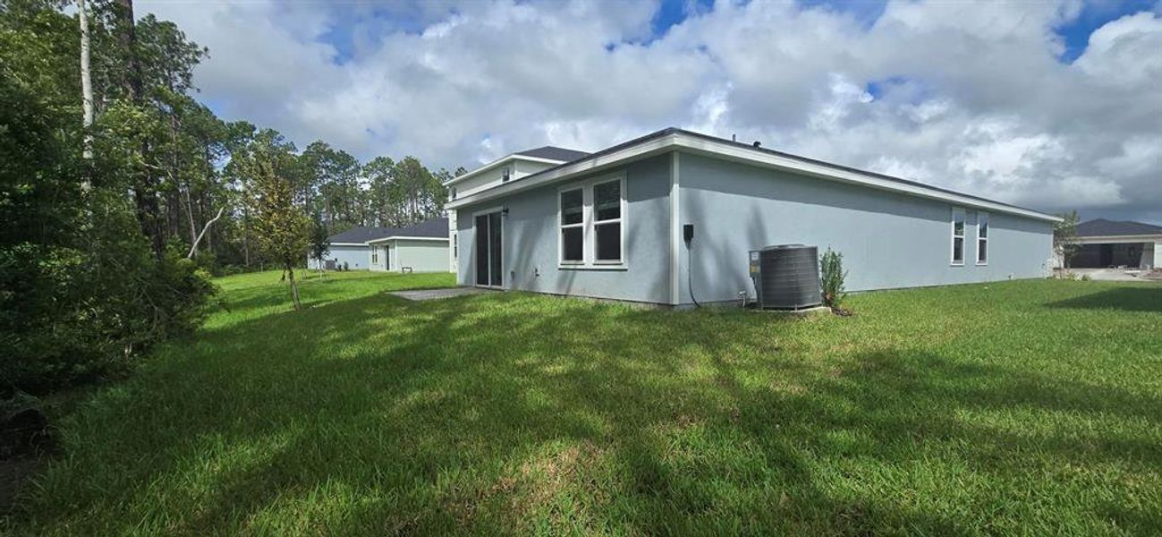 Exterior details and patio area of a home in Flagler Village - Classic Series, Palm Coast (Image 4).