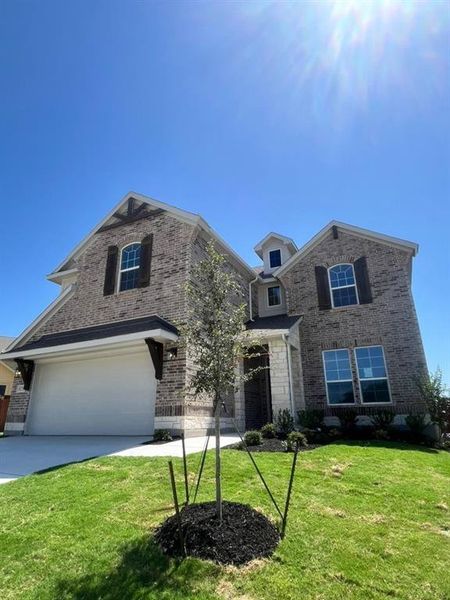 Front exterior of a new home in Westpoint Park, Fort Worth, TX, highlighting curb appeal (Image 2). Front exterior of a new home in Westpoint Park, Fort Worth, TX, highlighting curb appeal (Image 2).