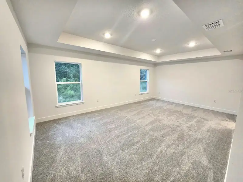 Spacious, unfurnished interior of a new home in Harmony Central, Harmony (Image 11).