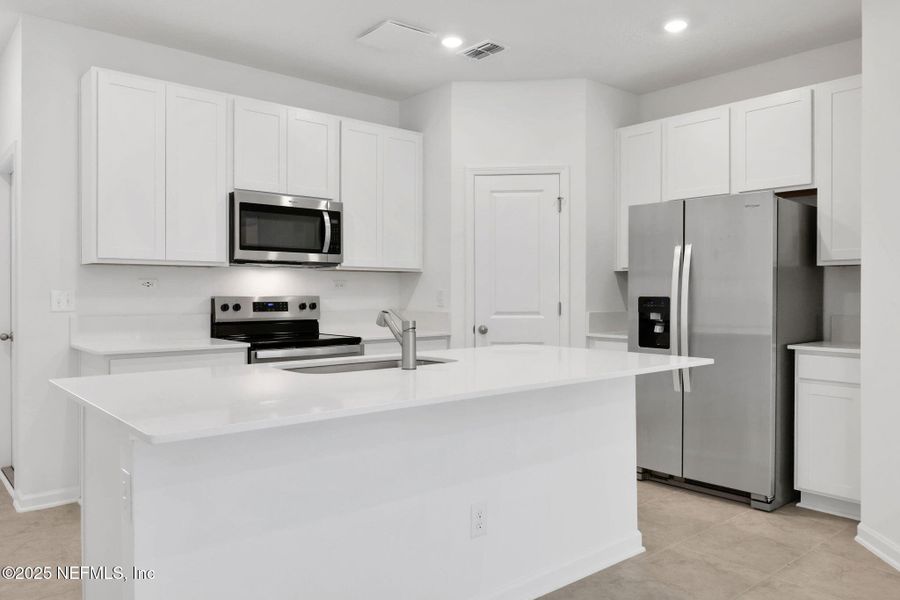 Furnished interior view inside a new home in Atlantis Pointe, Middleburg (Image 9).