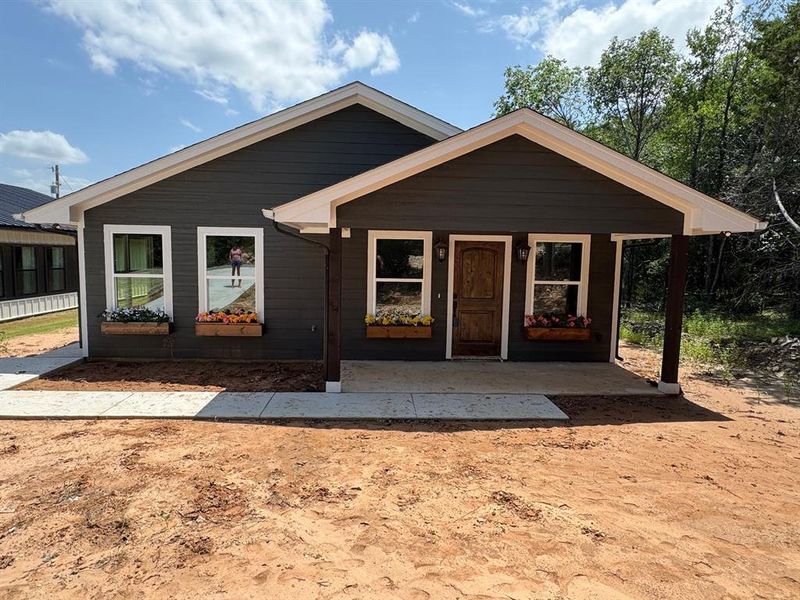 View of front of house featuring covered porch