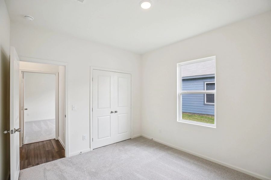 Representative unfurnished interior of a home built from the Glimmer by Starlight Homes in Spring Creek Trails, Magnolia (Image 17).