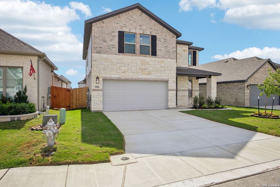 Front exterior of a new home in Kallison Ranch, San Antonio, TX, highlighting curb appeal (Image 25). Front exterior of a new home in Kallison Ranch, San Antonio, TX, highlighting curb appeal (Image 25).