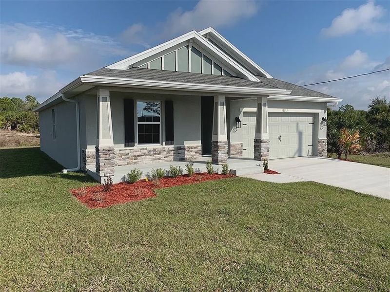 Front exterior of a new home in Gulf Cove, Port Charlotte, FL, highlighting curb appeal (Image 1). Front exterior of a new home in Gulf Cove, Port Charlotte, FL, highlighting curb appeal (Image 1).