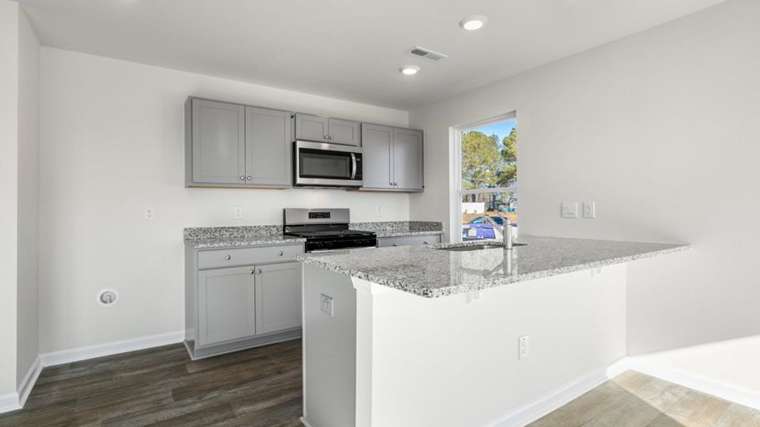 Furnished interior view inside a new home in The Townes at Honeycutt Oaks, Angier (Image 6).