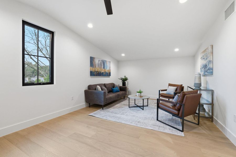 Living area with ceiling fan, light wood-type flooring, and recessed lighting