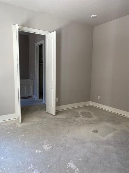 Spare room featuring concrete flooring