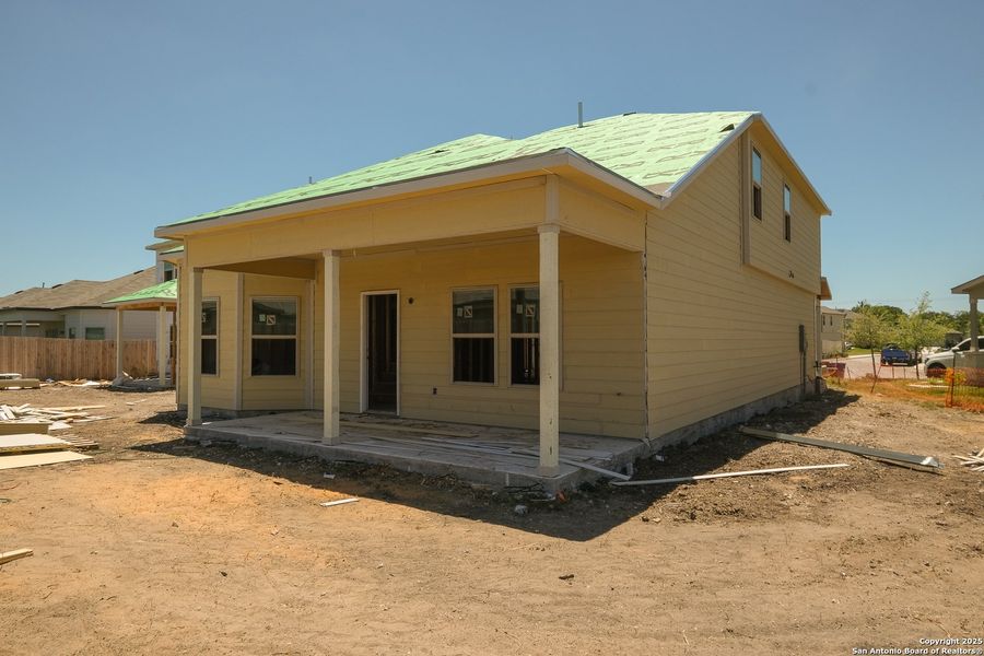 Front exterior of a new home in Blue Ridge Ranch, San Antonio, TX, highlighting curb appeal (Image 16).