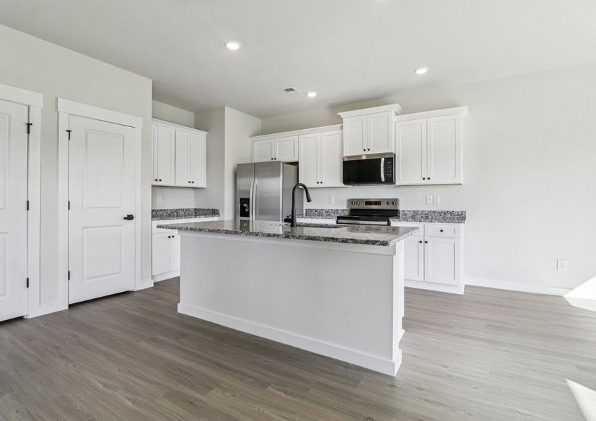 Vinyl flooring throughout.