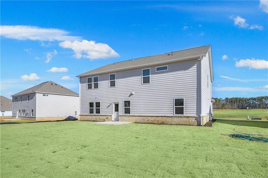Front exterior of a new home in Anderson Point Estates, McDonough, GA, highlighting curb appeal (Image 2).