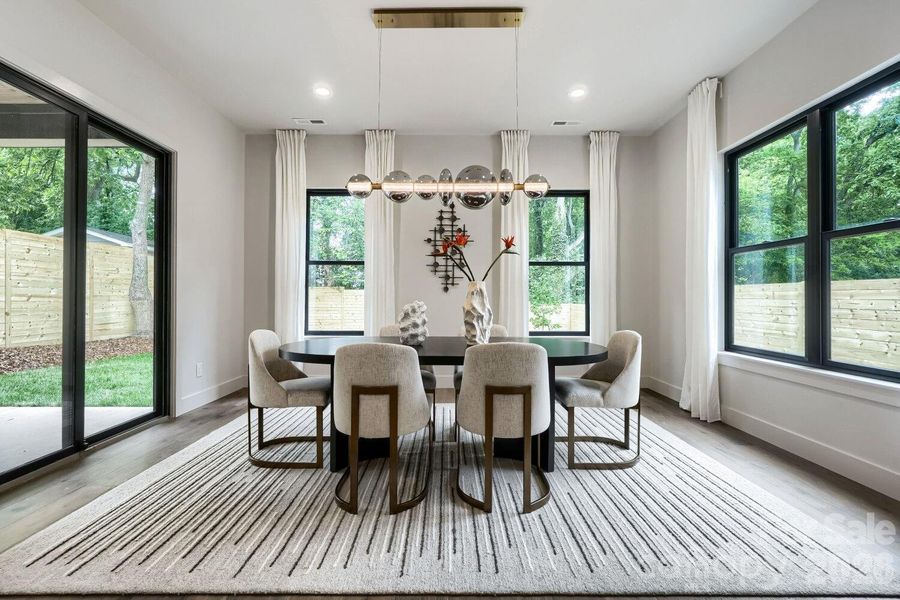 Dedicated Dining Room opens up to covered back porch