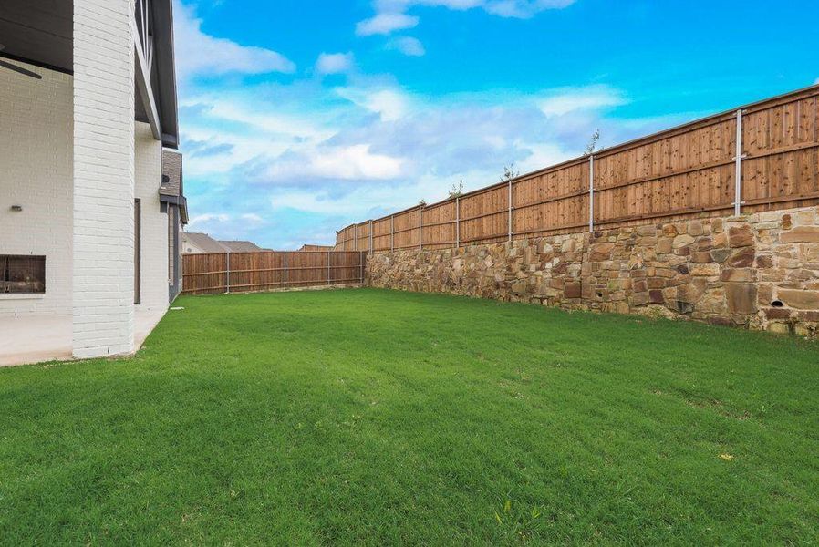 Front exterior of a new home in Monterra, Fate, TX, highlighting curb appeal (Image 17). Front exterior of a new home in Monterra, Fate, TX, highlighting curb appeal (Image 17).