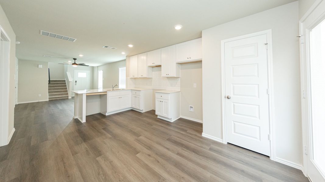 Dining Area to Kitchen and Family Room Dining Area to Kitchen and Family Room