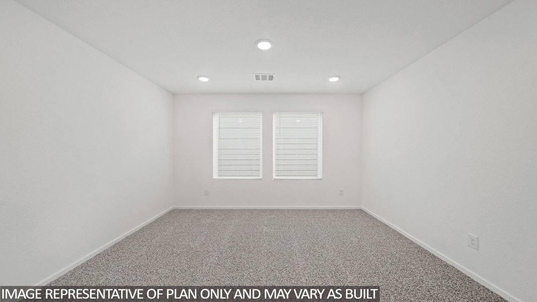 Room featuring neutral carpeting, white walls, two windows with blinds, and recessed lighting