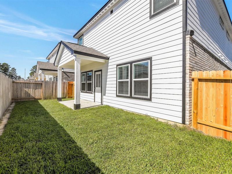 Exterior details and patio area of a home in Lakes at Black Oak, Magnolia (Image 19). Exterior details and patio area of a home in Lakes at Black Oak, Magnolia (Image 19).