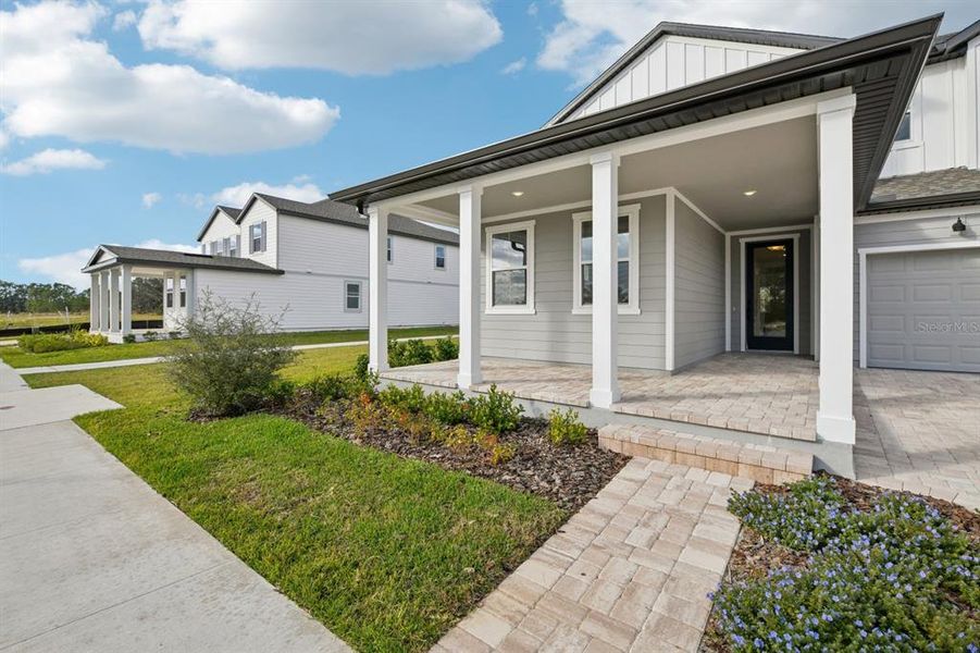 Exterior details and patio area of a home in Northlake Traditional, Winter Garden (Image 3). Exterior details and patio area of a home in Northlake Traditional, Winter Garden (Image 3).
