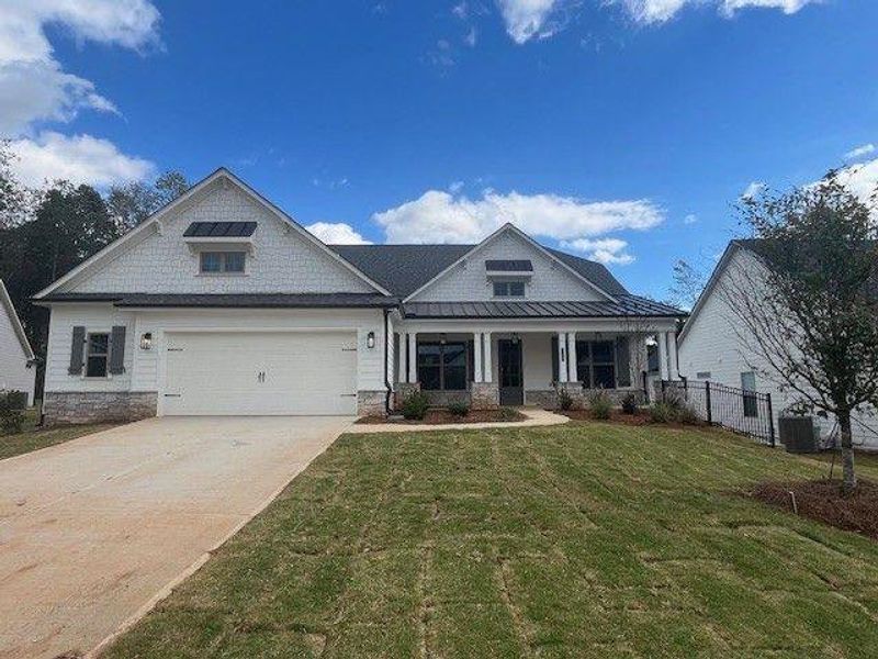 Front exterior of a new home in , Canton, GA, highlighting curb appeal (Image 1).