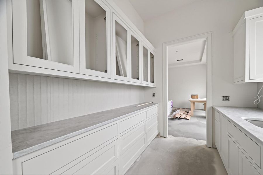 Another secondary large pantry in between the kitchen and dining room