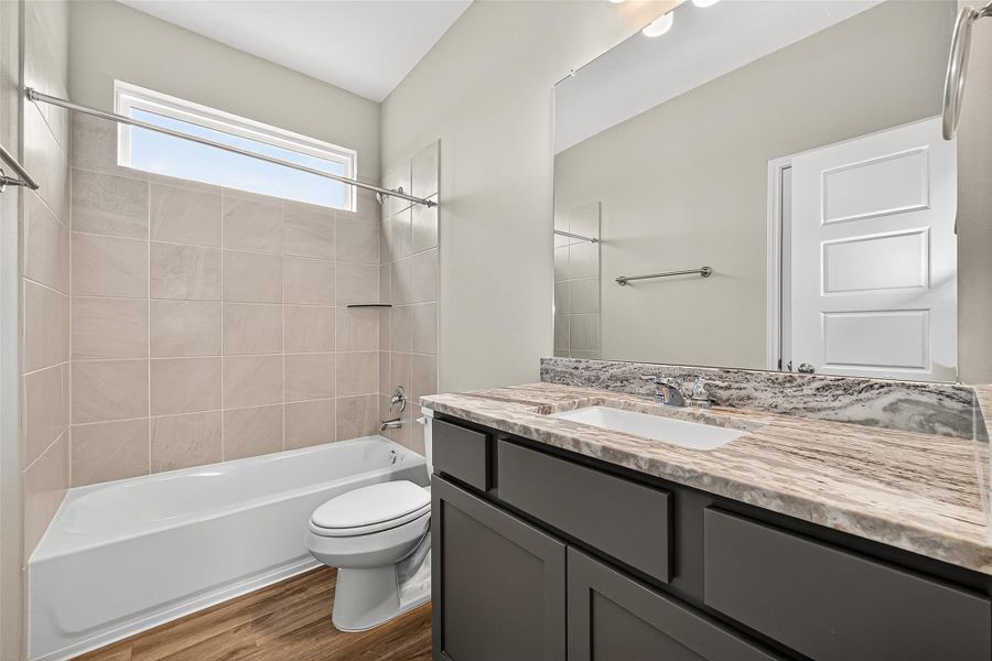 Furnished interior view inside a new home in Sunterra, Katy (Image 7).