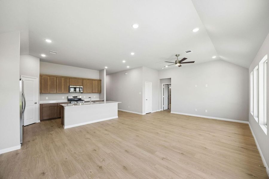 Dining and Living Area in the Sabine home plan by Trophy Signature Homes – REPRESENTATIVE