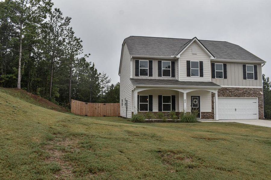 Front exterior of a new home in , Dallas, GA, highlighting curb appeal (Image 35). Front exterior of a new home in , Dallas, GA, highlighting curb appeal (Image 35).