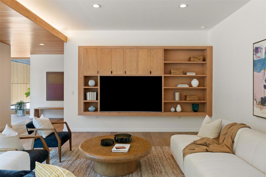 Living room with recessed lighting and light wood-style floors