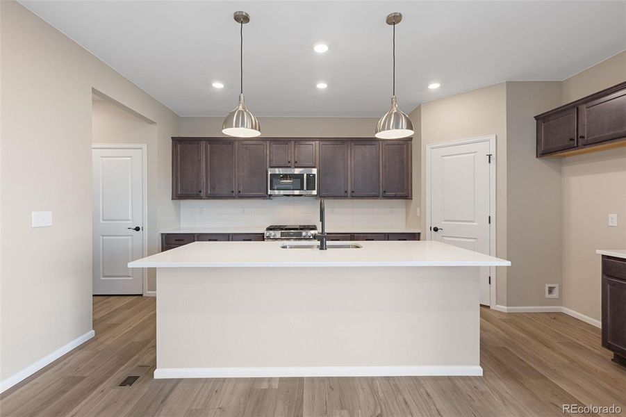 Furnished interior view inside a new home in The Cottages Collection at Ridgeline Vista, Brighton (Image 10).