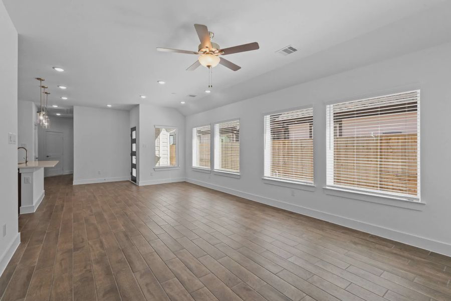 Representative unfurnished interior of a home built from the Carriagehouse by Chesmar Homes in Meridiana Townhomes, Iowa Colony (Image 70).