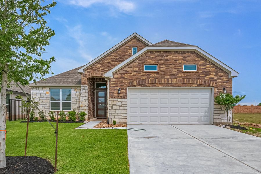 Representative exterior photo of a completed home built from the Floor Plan 2620 by Colina Homes in Woodland Lakes, Huffman, TX (Image 2). Representative exterior photo of a completed home built from the Floor Plan 2620 by Colina Homes in Woodland Lakes, Huffman, TX (Image 2).