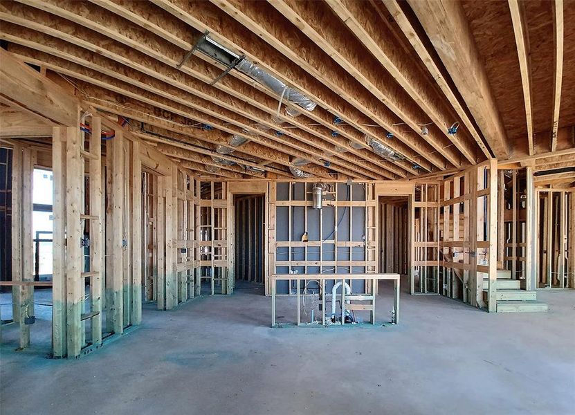 View of this spacious Kitchen underway opening to the Butler's Pantry, Breakfast Area and fabulous two-story Family Room just beyond it.