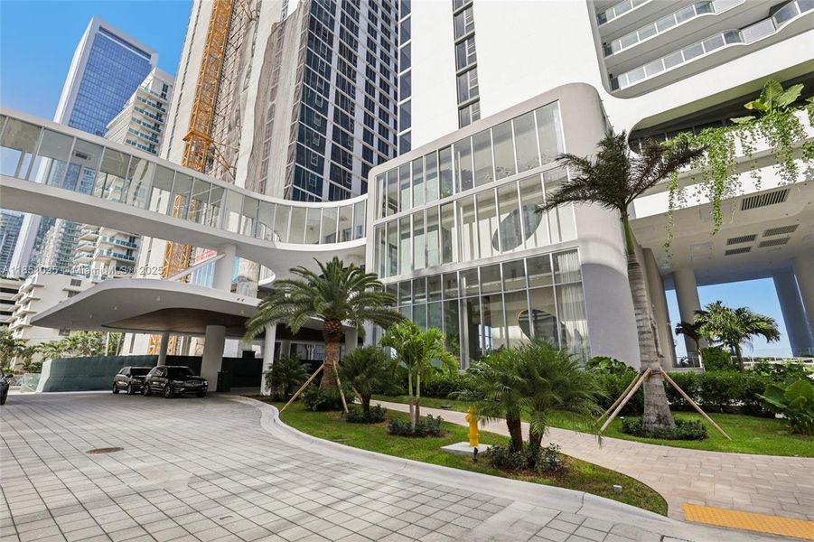 Front exterior of a new home in Aria Reserve, Miami, FL, highlighting curb appeal (Image 1).
