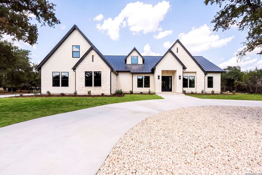 Front exterior of a new home in , Boerne, TX, highlighting curb appeal (Image 27).