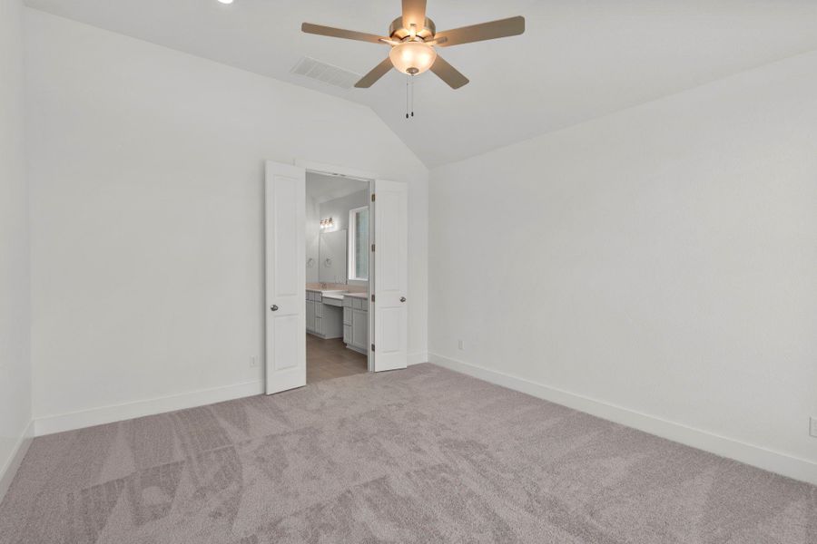 Primary Bedroom with elevated ceiling Primary Bedroom with elevated ceiling
