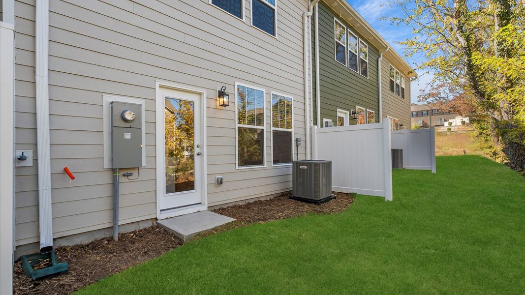 Accomplished exterior with a spacious backyard that blends comfort and style in Arden, NC