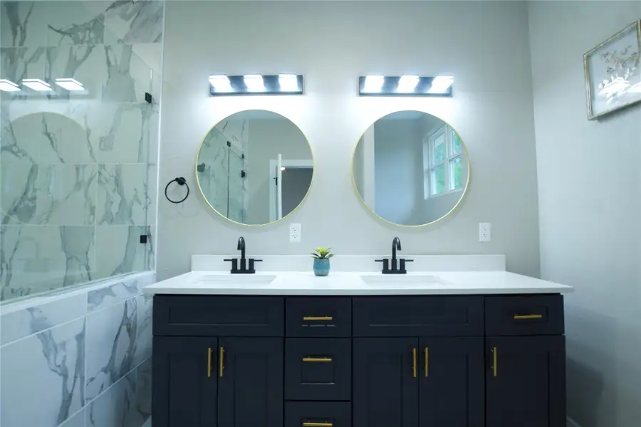 Full bathroom with double vanity