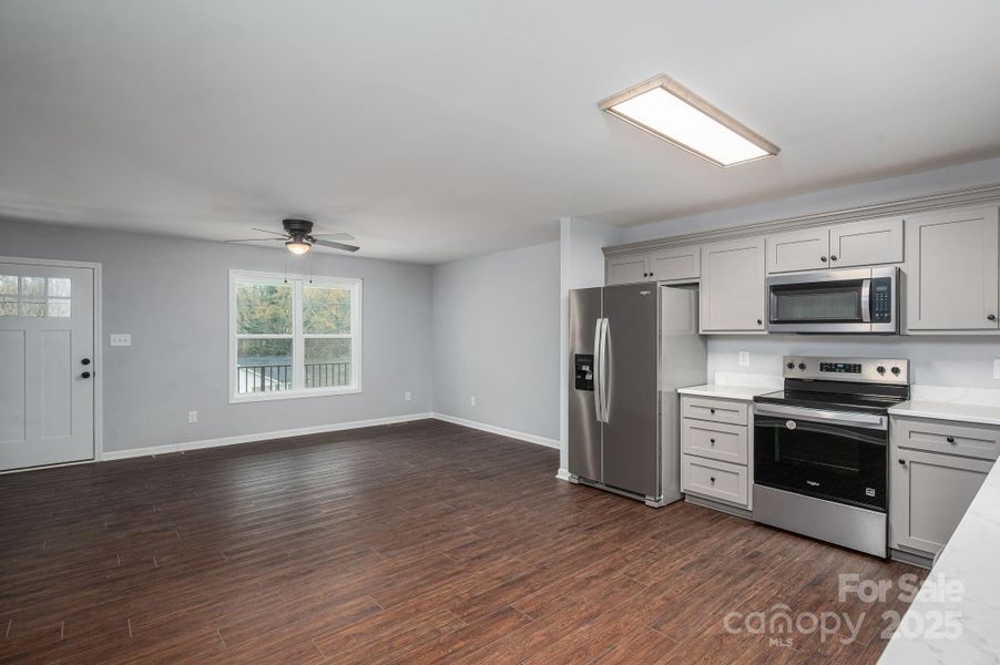 Looking from back door to Living Room and Kitchen Looking from back door to Living Room and Kitchen