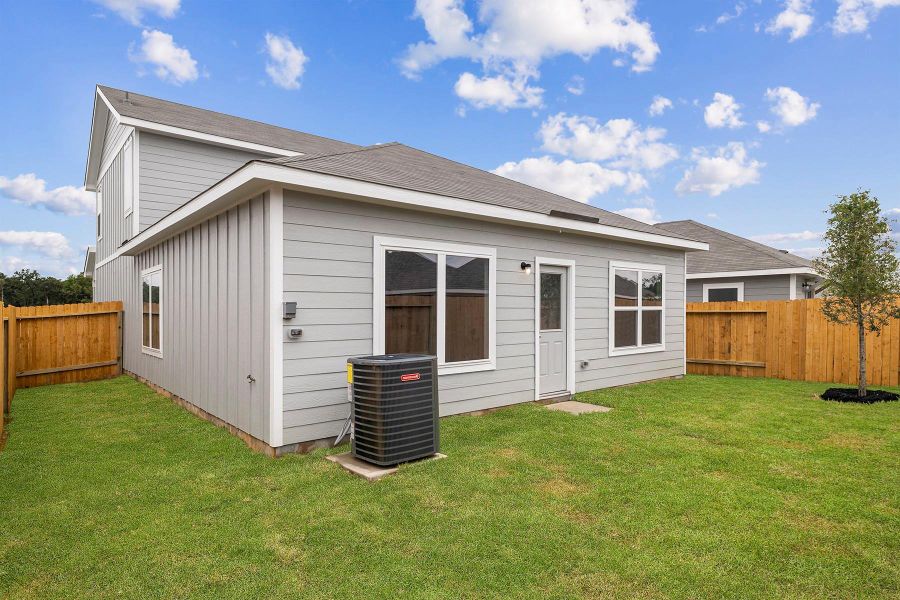Front exterior of a new home in Magnolia Woods, Magnolia, TX, highlighting curb appeal (Image 20).