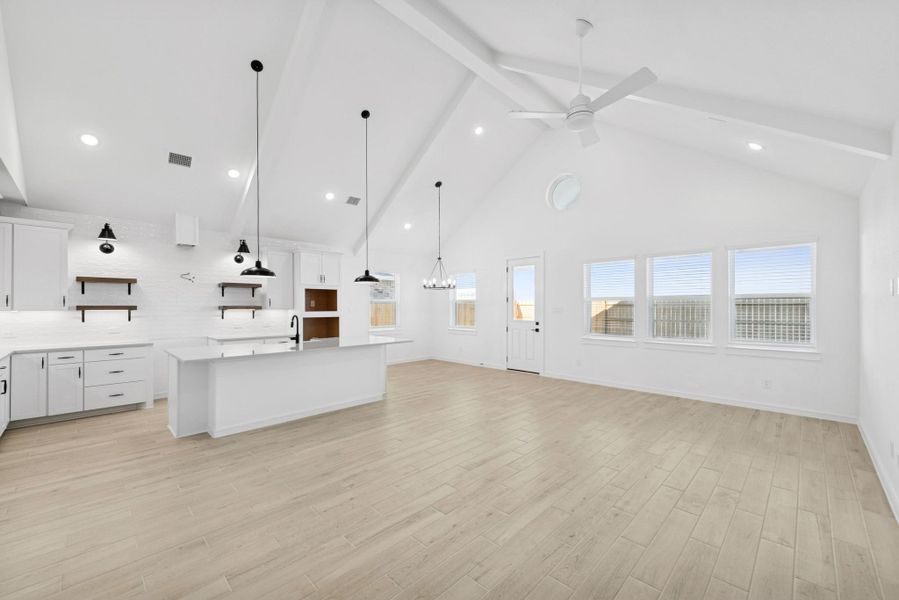 Bright and airy living space with vaulted ceilings and painted beams