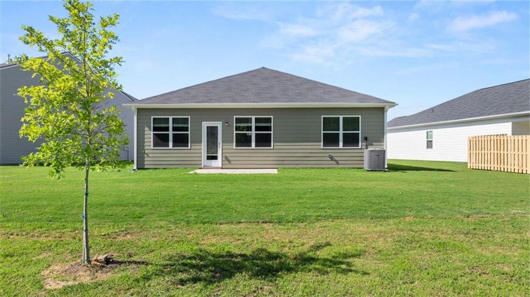 Exterior details and patio area of a home in The Preserve at Agricultural Village, Perry (Image 3).