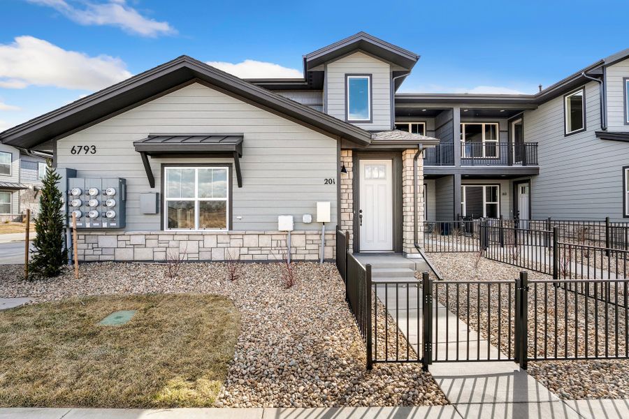 Front exterior of a new home in Wilder at Timnath Ranch, Timnath, CO, highlighting curb appeal (Image 1). Front exterior of a new home in Wilder at Timnath Ranch, Timnath, CO, highlighting curb appeal (Image 1).