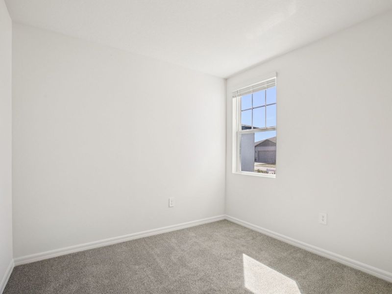 Spacious, unfurnished interior of a new home in The Grove at Stuart Crossing - Premier Series, Bartow (Image 14).