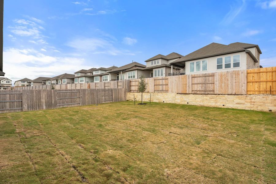 Exterior details and patio area of a home in Lariat, Liberty Hill (Image 25).