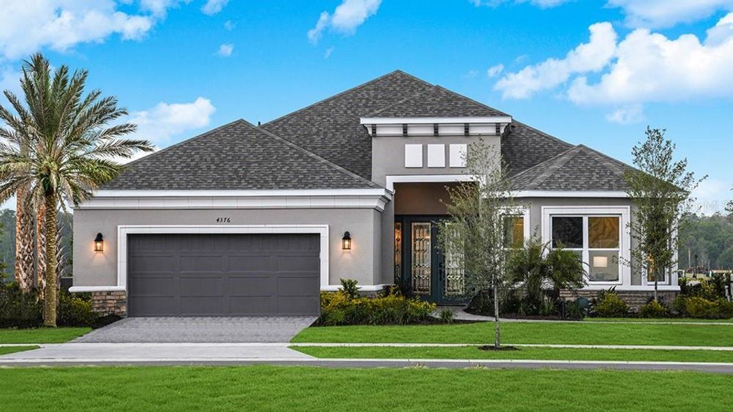 Front exterior of a new home in Esplanade at Westview, Kissimmee, FL, highlighting curb appeal (Image 1). Front exterior of a new home in Esplanade at Westview, Kissimmee, FL, highlighting curb appeal (Image 1).